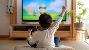 ゲームをクリアして喜ぶ子ども
